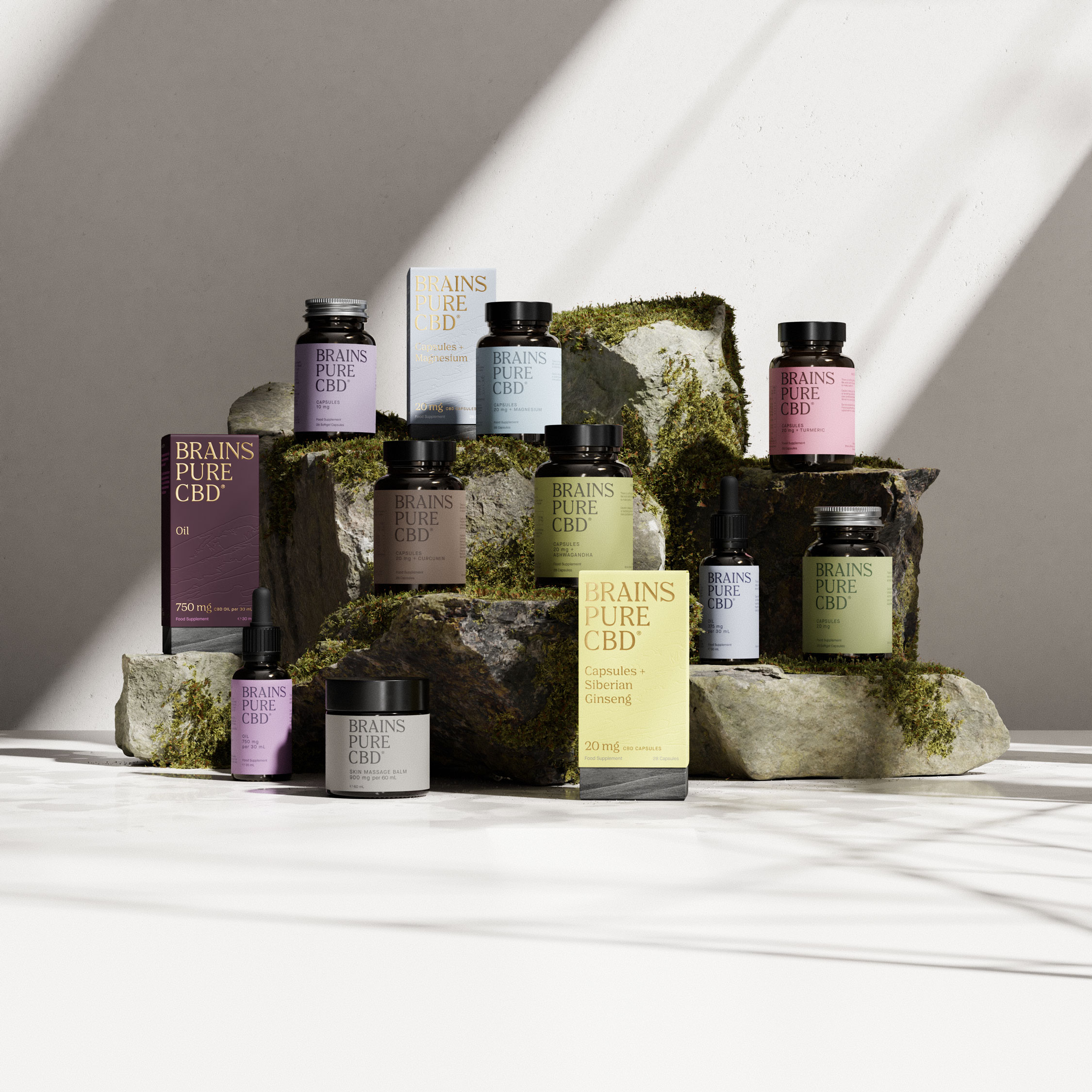 Image of CBD made product in aesthetic bottle placed on top of rocks